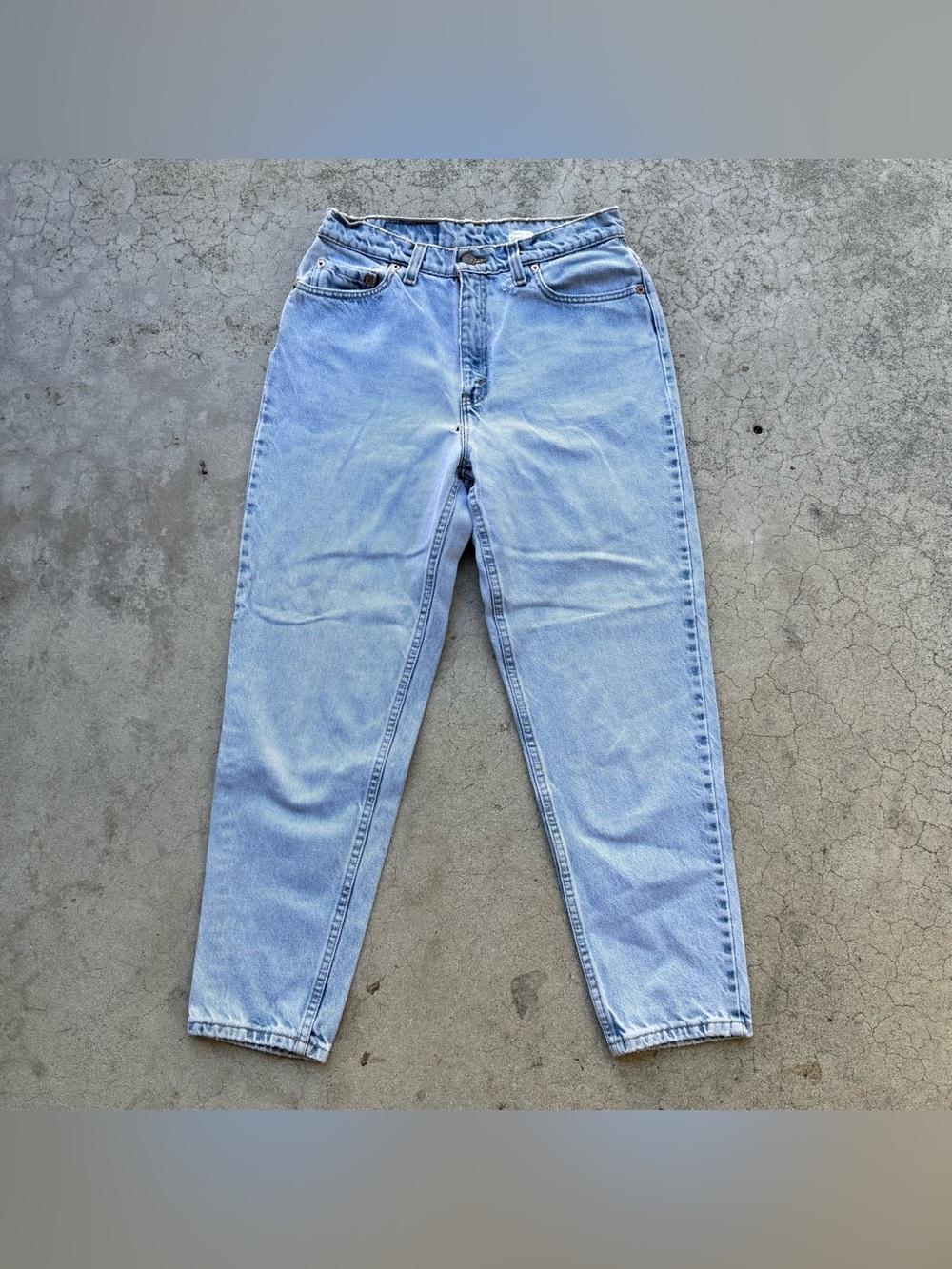 Vintage 90’s Distressed Levi's 521 Tapered Fit Light Wash Blue Jeans Size 28”